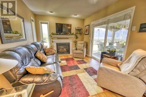 3808 Sawgrass Drive, Osoyoos, BC - Indoor Photo Showing Living Room With Fireplace