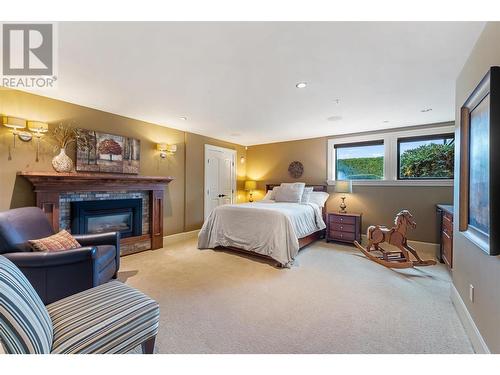 5958/5960 Old Kamloops Road, Vernon, BC - Indoor Photo Showing Bedroom With Fireplace