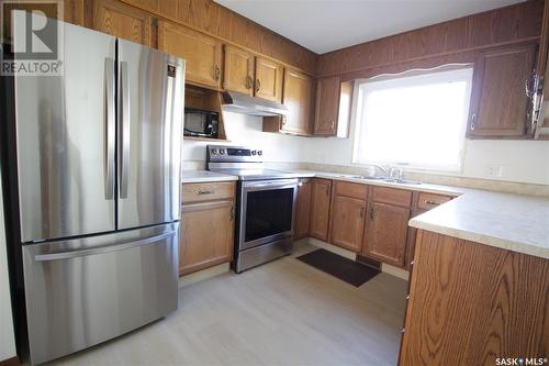 217 4Th Avenue, Whitewood, SK - Indoor Photo Showing Kitchen With Double Sink