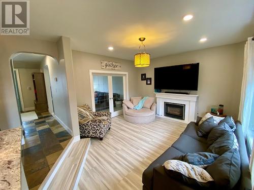 10701 Cyprus Court, Dawson Creek, BC - Indoor Photo Showing Other Room With Fireplace