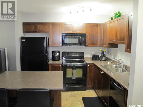 407 306 Petterson Drive, Estevan, SK - Indoor Photo Showing Kitchen With Double Sink