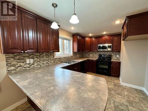 13368 Elk Ridge Trail, Dawson Creek, BC - Indoor Photo Showing Kitchen With Double Sink