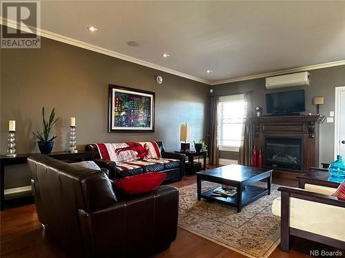 163 Craig Street, Charlo, NB - Indoor Photo Showing Living Room With Fireplace