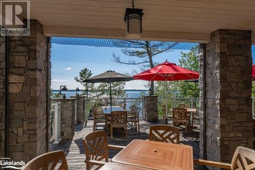 Restaurant patio - 1869 Muskoka 118 Highway W Unit# A201-C1 Or C2, Muskoka Lakes, ON - Outdoor With Deck Patio Veranda With Exterior