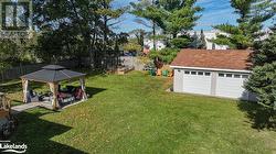 Large Backyard with Raised Garden Beds, Garage/storage/hobby Building, Gazebo and Hot tub - 