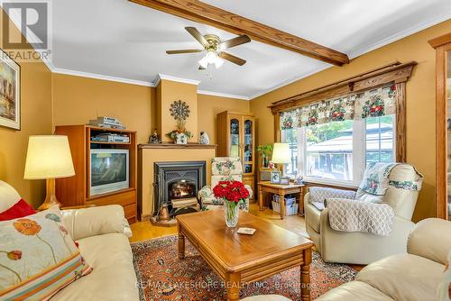 3115 Meyers Road, Hamilton Township, ON - Indoor Photo Showing Living Room With Fireplace