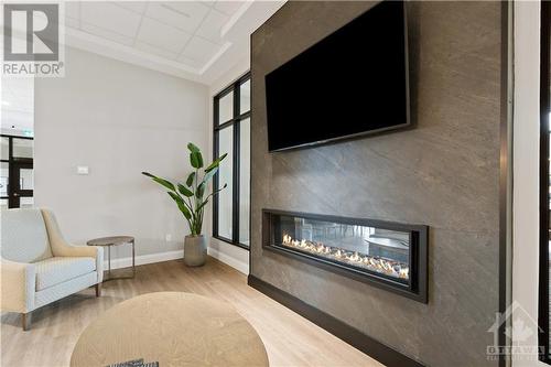 Shared common space - 31 Eric Devlin Lane Unit#204, Perth, ON - Indoor Photo Showing Living Room With Fireplace