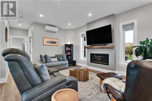 684B Garden Of Eden Road, Renfrew, ON - Indoor Photo Showing Living Room With Fireplace