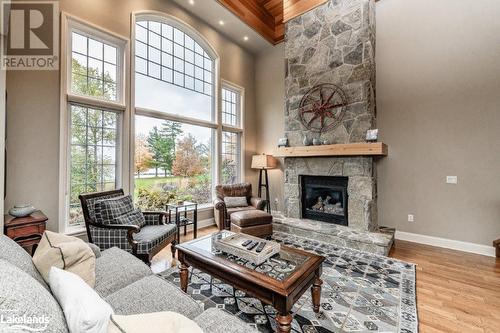 3876 Muskoka 118 Road W Unit# Carling 6-W5, Port Carling, ON - Indoor Photo Showing Living Room With Fireplace