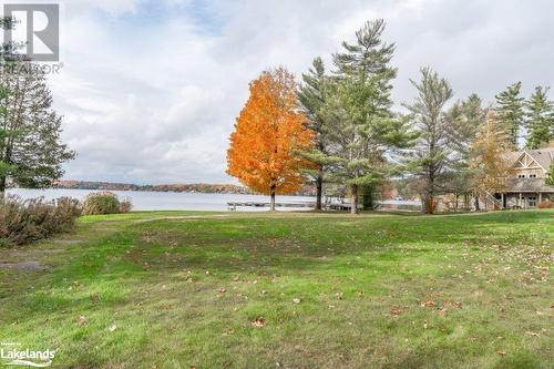 Landscaped grounds - 3876 Muskoka 118 Road W Unit# Carling 6-W5, Port Carling, ON - Outdoor With Body Of Water With View