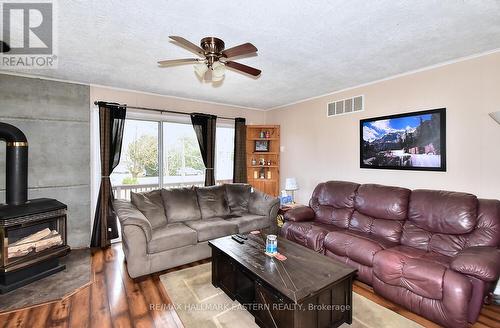233 Crosby Drive, Kawartha Lakes, ON - Indoor Photo Showing Living Room With Fireplace
