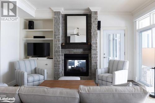 1869 Muskoka Road 118 Highway W Unit# A104-C2, Muskoka Lakes, ON - Indoor Photo Showing Living Room With Fireplace