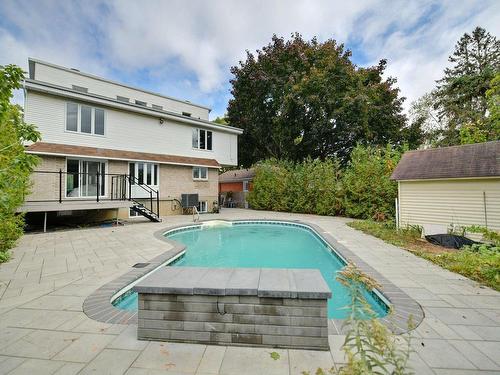 Back facade - 26 Rue Alexandre, Laval (Pont-Viau), QC - Outdoor With In Ground Pool With Deck Patio Veranda