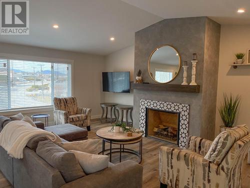 4422-4424 Oleander Drive, Osoyoos, BC - Indoor Photo Showing Living Room With Fireplace