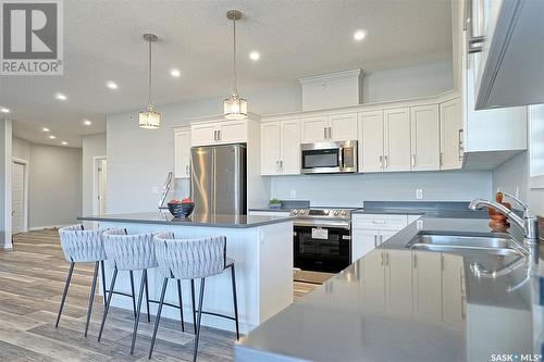 #403 131 Beaudry Crescent, Martensville, SK - Indoor Photo Showing Kitchen With Double Sink With Upgraded Kitchen