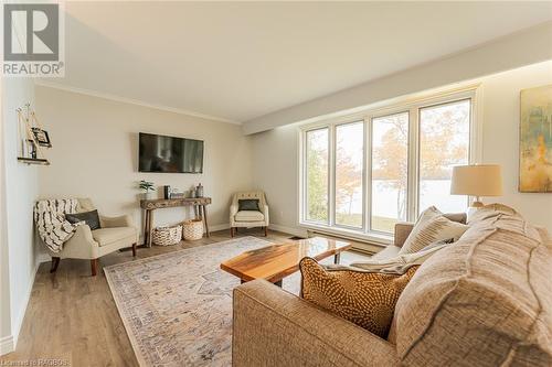 Upper Level Wall of Window Water Views - 2945 Bruce Road 13, Oliphant, ON - Indoor Photo Showing Living Room