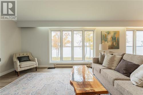 Upper Level Wall of Window Water Views - 2945 Bruce Road 13, Oliphant, ON - Indoor Photo Showing Living Room