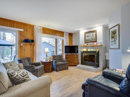 Living room - 80 1Re Rue Du Mont-Suisse, Saint-Sauveur, QC - Indoor Photo Showing Living Room With Fireplace