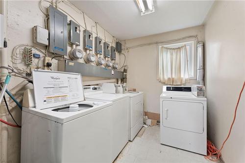 coin op laundry - 256 South Drive, Simcoe, ON - Indoor Photo Showing Laundry Room