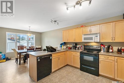 312 33Rd Street E, Saskatoon, SK - Indoor Photo Showing Kitchen With Double Sink