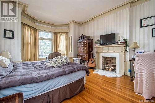 70 Orange Street, Saint John, NB - Indoor Photo Showing Bedroom With Fireplace