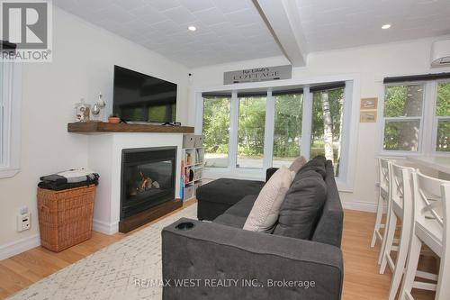 45 32Nd Street N, Wasaga Beach, ON - Indoor Photo Showing Living Room With Fireplace