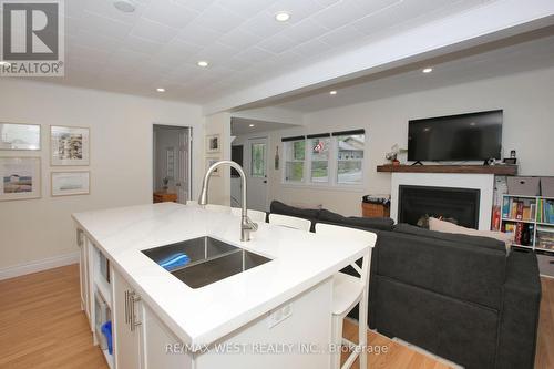 45 32Nd Street N, Wasaga Beach, ON - Indoor Photo Showing Kitchen With Fireplace With Double Sink