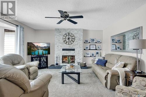 22 Lloyd Crescent, Fillmore, SK - Indoor Photo Showing Living Room With Fireplace