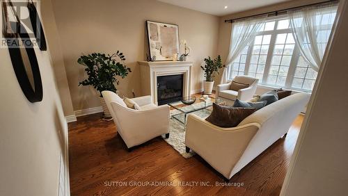 25 - 1455 O'Connor Drive, Toronto, ON - Indoor Photo Showing Living Room With Fireplace