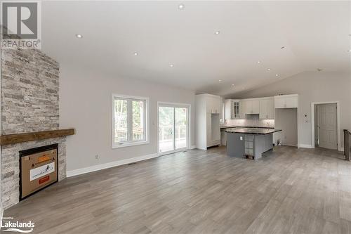 Home Previously Built - similar model - Lot 13 Voyageur Drive, Tiny, ON - Indoor With Fireplace