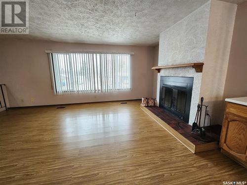 571 13Th Street Ne, Weyburn, SK - Indoor Photo Showing Living Room With Fireplace