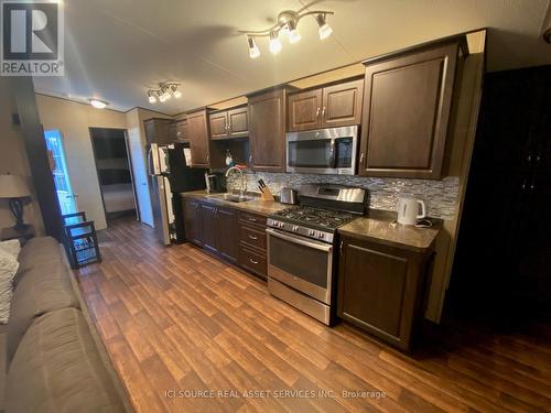 #101 -1235 Villiers Line, Otonabee-South Monaghan, ON - Indoor Photo Showing Kitchen With Double Sink