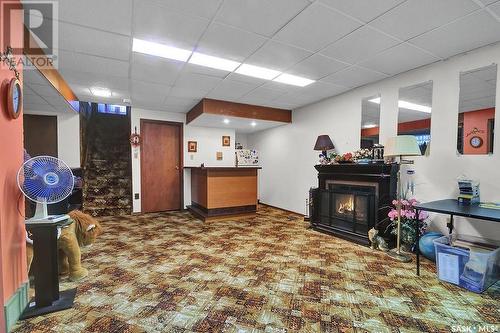 42 Metcalfe Road, Regina, SK - Indoor Photo Showing Other Room With Fireplace