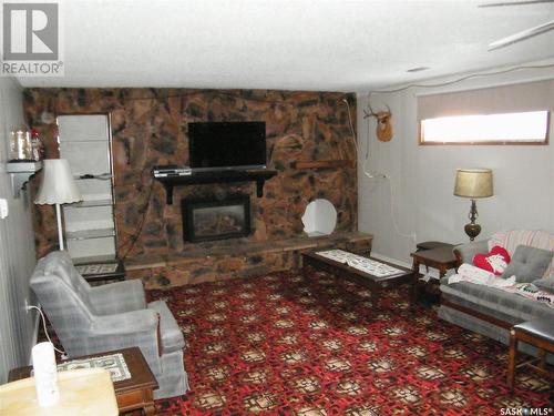 26 Drobot Street, Quill Lake, SK - Indoor Photo Showing Living Room With Fireplace