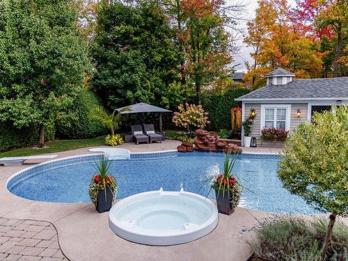 Hot tub - 119 Rue Antoine-Forestier, Carignan, QC - Outdoor With In Ground Pool With Backyard