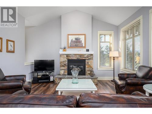 251 Predator Ridge Drive Unit# 18, Vernon, BC - Indoor Photo Showing Living Room With Fireplace