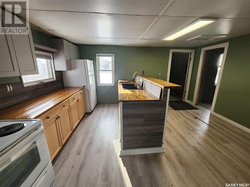 73 3Rd Avenue E, Central Butte, SK - Indoor Photo Showing Kitchen With Double Sink
