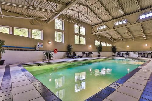213 - 1500 Mcdonald Avenue, Fernie, BC - Indoor Photo Showing Other Room With In Ground Pool