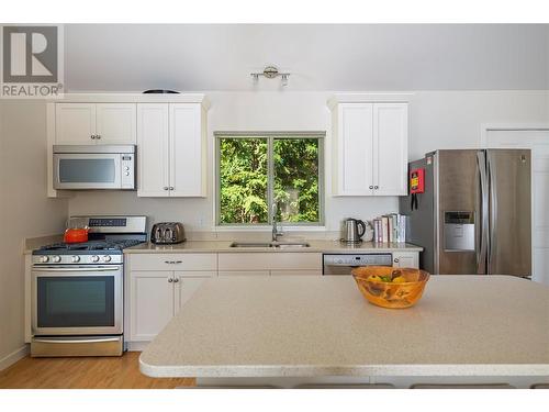 8100/8104 Silver Star Road, Vernon, BC - Indoor Photo Showing Kitchen With Double Sink