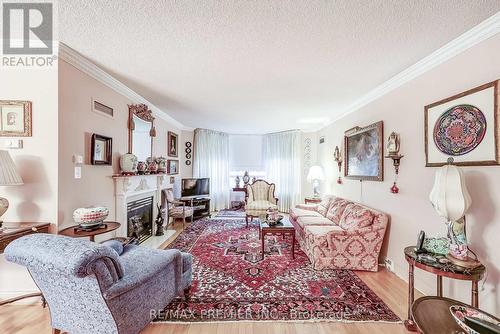#1026 -138 Bonis Ave, Toronto, ON - Indoor Photo Showing Living Room With Fireplace