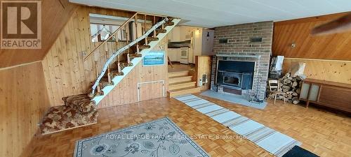 94 Mikolla Rd, Marmora And Lake, ON - Indoor With Fireplace
