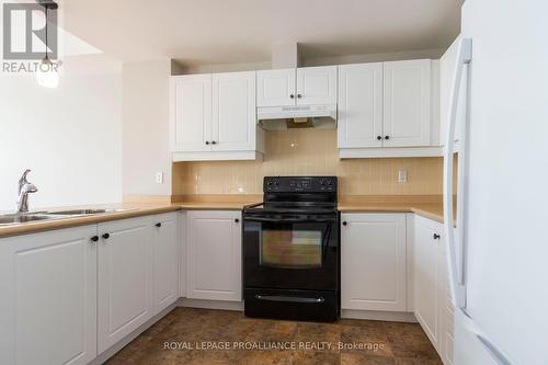 301 - 145 Third Street, Cobourg, ON - Indoor Photo Showing Kitchen With Double Sink