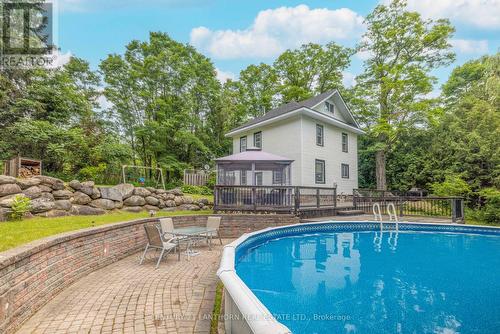 114 Bullis Road N, Brighton, ON - Outdoor With Above Ground Pool With Deck Patio Veranda With Backyard