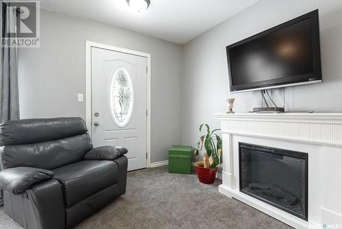213 Patrick Street, Lipton, SK - Indoor Photo Showing Living Room With Fireplace