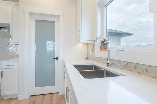 58 Wild Plum Lane, Steinbach, MB - Indoor Photo Showing Kitchen With Double Sink