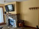 107 - 2080 Summit Drive, Panorama, BC  - Indoor Photo Showing Living Room With Fireplace 
