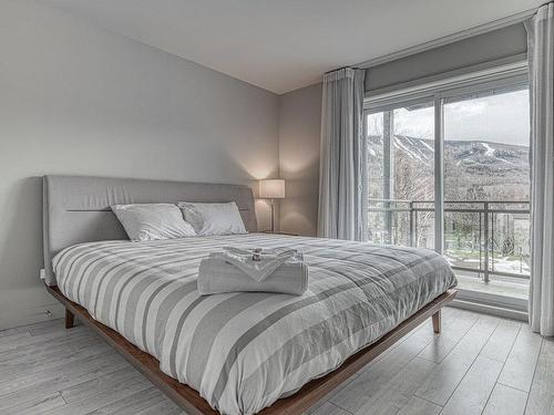 Chambre Ã Â coucher - 319-201 Rue Du Val-Des-Neiges, Beaupré, QC - Indoor Photo Showing Bedroom