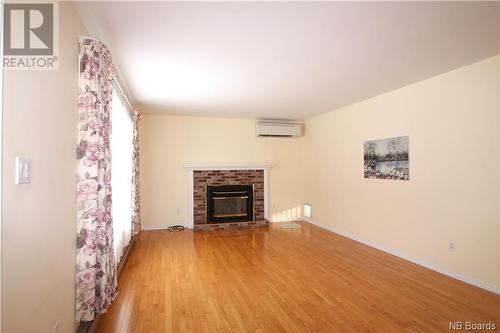 45 Route 735, Mayfield, NB - Indoor Photo Showing Living Room With Fireplace