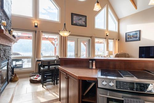 8550 Beach Street, Balfour, BC - Indoor Photo Showing Kitchen With Fireplace