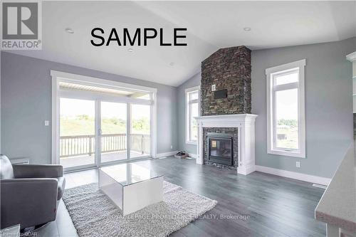 7 Clayton John Avenue, Brighton, ON - Indoor Photo Showing Living Room With Fireplace